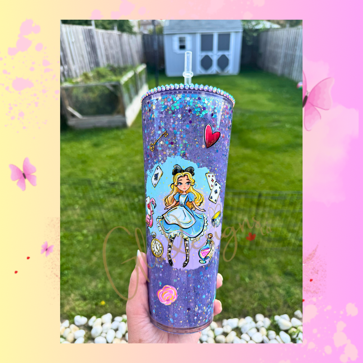 Alice in Wonderlad Snowglobe 24 oz., suspended style.